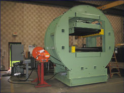 load inverters, material handling inverters, barrel inverter with powered conveyor, sometimes called a flipper or flopper or turner