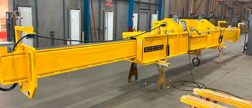 A Telescoping magnet beam manufactured by Bushman Equipment being tested before being shipped to their customer, a major Steel Manufacturer and Recycler in the United States